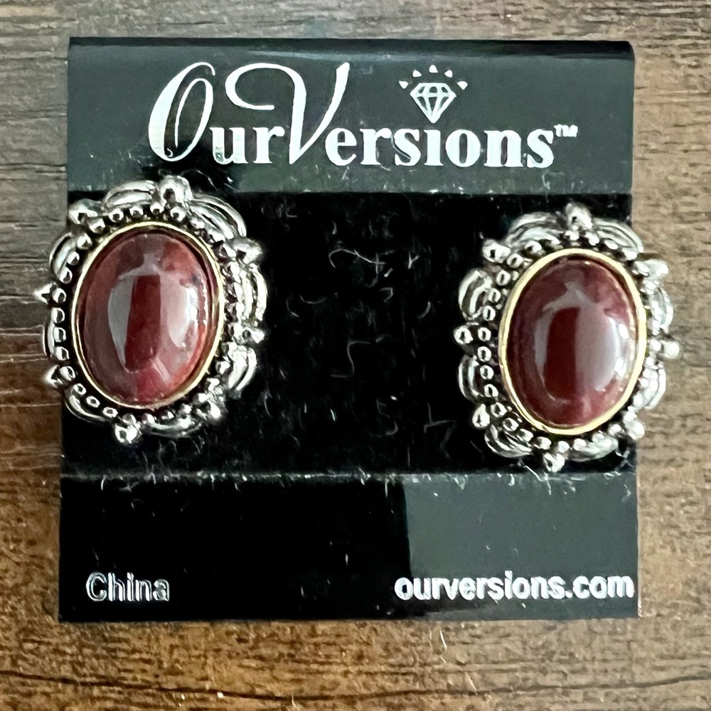 Our Versions Clip-On Earrings with a brown stone and antiques silver setting.